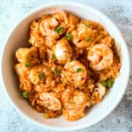 Risotto marinara in a white bowl.